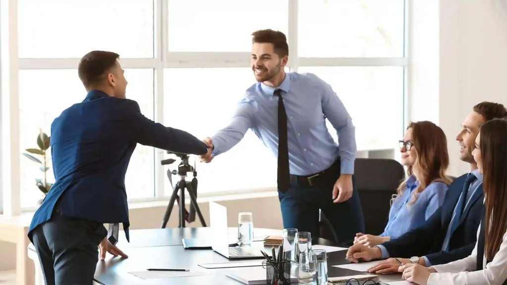 Job consultancy in Abu Dhabi - candidate and employer handshake